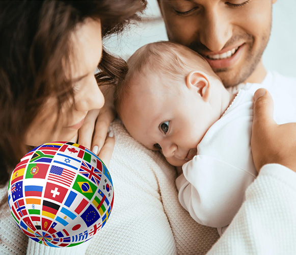family with a baby and the globe with country flags