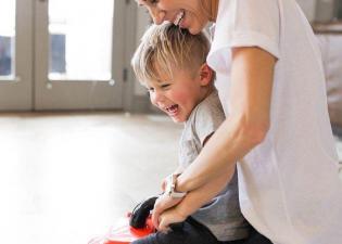 Mom And A Kid Playing
