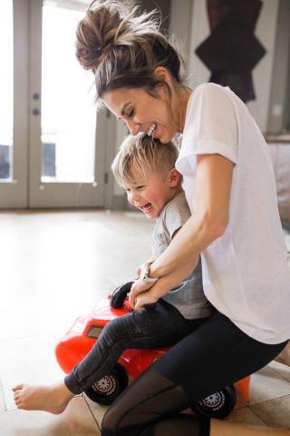 Mom And A Kid Playing